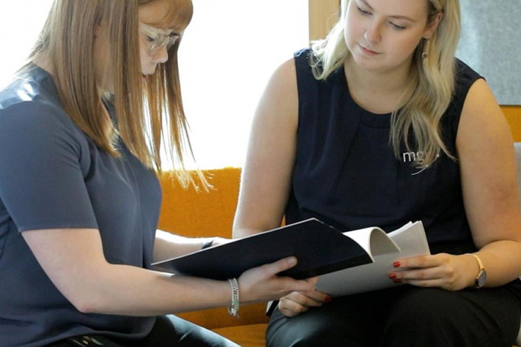 an mgi small business accountant working with a client